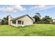 The back of the house has a door to the yard which is surrounded by a wood fence at 7810 Wortham Ct, Orlando, FL 32825