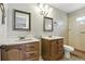 Bathroom featuring double sinks, tiled floors, and updated lighting at 7810 Wortham Ct, Orlando, FL 32825