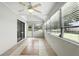 A bright and airy Florida room with neutral tile floor and many windows at 7810 Wortham Ct, Orlando, FL 32825