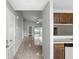 Spacious home interior featuring neutral walls, tile flooring, and an open layout with views of the screened-in lanai at 7810 Wortham Ct, Orlando, FL 32825