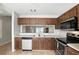 Traditional kitchen with stainless steel appliances and wood cabinets at 7810 Wortham Ct, Orlando, FL 32825