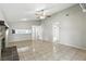 Bright, spacious living room featuring vaulted ceilings, tile flooring, access to additional rooms, and a brick fireplace at 7810 Wortham Ct, Orlando, FL 32825