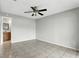 Spacious bedroom with ceiling fan and tile flooring at 7810 Wortham Ct, Orlando, FL 32825