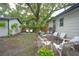 Inviting backyard with stone patio, surrounded by lush trees, great for entertaining at 805 E 20Th St, Sanford, FL 32771