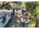 Aerial view of the backyard with patio, lush trees, and fence, creating a private retreat at 805 E 20Th St, Sanford, FL 32771