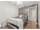 Stylish bedroom with hardwood floors and floral wallpaper, with an ensuite bathroom at 805 E 20Th St, Sanford, FL 32771