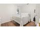 Bright bedroom featuring hardwood floors, and a comfortable bed with white linens at 805 E 20Th St, Sanford, FL 32771