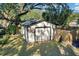 Garage exterior showcasing a simple design and complemented by a well-kept lawn at 805 E 20Th St, Sanford, FL 32771