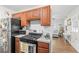 Well-equipped kitchen featuring wood cabinets, stainless steel appliances, and a gas range at 805 E 20Th St, Sanford, FL 32771