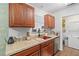 Functional kitchen featuring wood cabinets, modern appliances, and ample counter space at 805 E 20Th St, Sanford, FL 32771