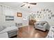Bright living room features hardwood floors, neutral furniture, and charming decor at 805 E 20Th St, Sanford, FL 32771