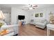 Inviting living room with hardwood floors, neutral furniture, and a bright window view at 805 E 20Th St, Sanford, FL 32771