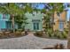 Serene backyard patio with lush landscaping, comfortable seating, and pathways throughout the community at 8061 Lost Shaker Ln, Kissimmee, FL 34747