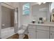 Clean bathroom featuring a tub, shower, toilet, and a white vanity with ample counter space at 8061 Lost Shaker Ln, Kissimmee, FL 34747