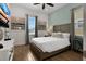 Comfortable bedroom with a king-size bed, stylish decor, and plenty of natural light from the windows at 8061 Lost Shaker Ln, Kissimmee, FL 34747