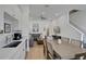 Bright open floor plan with a dining area, kitchen, and a comfortable living room with neutral tones at 8061 Lost Shaker Ln, Kissimmee, FL 34747