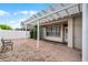 Back patio features a brick paver patio with a white pergola and white fence at 12524 Aldershot Ln, Windermere, FL 34786