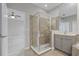 Bathroom featuring a tiled shower, single vanity, and a neutral color scheme at 12524 Aldershot Ln, Windermere, FL 34786