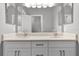 Close up of bathroom vanity with double sinks, quartz countertop, and modern faucets at 12524 Aldershot Ln, Windermere, FL 34786