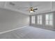 Expansive bedroom featuring plush carpet, trey ceiling, and lots of natural light at 12524 Aldershot Ln, Windermere, FL 34786