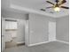 Bedroom view showcasing an open door to the kitchen, neutral colors, and ample natural light at 12524 Aldershot Ln, Windermere, FL 34786
