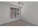 Bedroom showcasing a large window with blinds and neutral carpet at 12524 Aldershot Ln, Windermere, FL 34786