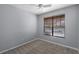 Bedroom featuring a ceiling fan and a window with wooden blinds at 12524 Aldershot Ln, Windermere, FL 34786