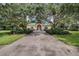 Community clubhouse with manicured landscaping and a gated entrance at 12524 Aldershot Ln, Windermere, FL 34786