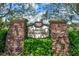 Stone entrance sign for the 'Lakes of Windermere' community amidst lush greenery at 12524 Aldershot Ln, Windermere, FL 34786