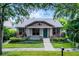 Charming single-story home with landscaped front yard and inviting blue door at 12524 Aldershot Ln, Windermere, FL 34786