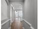 Hallway with hardwood flooring and archways leading to other rooms at 12524 Aldershot Ln, Windermere, FL 34786