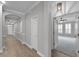Hallway with hardwood flooring and archways leading to other rooms at 12524 Aldershot Ln, Windermere, FL 34786