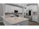 A chef's kitchen with quartz countertops and stainless steel appliances at 12524 Aldershot Ln, Windermere, FL 34786
