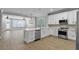 Modern kitchen with stainless steel appliances and an island at 12524 Aldershot Ln, Windermere, FL 34786