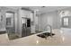 Spacious kitchen island with modern appliances and quartz countertops at 12524 Aldershot Ln, Windermere, FL 34786