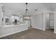 Open kitchen with granite countertops, stainless appliances, and modern lighting fixtures at 12524 Aldershot Ln, Windermere, FL 34786