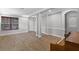 Sunlit living room with wood flooring, piano, and a view of the front door at 12524 Aldershot Ln, Windermere, FL 34786