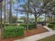 A large fenced in playground with various slides, swings and climbing apparatuses at 12524 Aldershot Ln, Windermere, FL 34786