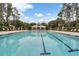 A long swimming pool with markers and a covered pool house at 12524 Aldershot Ln, Windermere, FL 34786