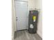 A utility room with a new water heater and ample space for storage at 2075 Dixie Ave, Sanford, FL 32771