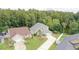 Aerial view of home situated on a well-manicured lot with mature trees at 2262 Stonehedge Loop, Kissimmee, FL 34743