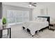 Comfortable bedroom with natural light, neutral decor, and stylish furnishings at 2262 Stonehedge Loop, Kissimmee, FL 34743