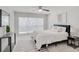 Comfortable bedroom with natural light, neutral decor, and stylish furnishings at 2262 Stonehedge Loop, Kissimmee, FL 34743