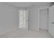 Spacious bedroom view showcasing open doorways, light-colored walls, and neutral carpeting at 2262 Stonehedge Loop, Kissimmee, FL 34743