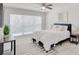 Comfortable bedroom with natural light, neutral decor, and stylish furnishings at 2262 Stonehedge Loop, Kissimmee, FL 34743