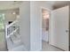 Open foyer with staircase leading to the second floor and adjacent half-bathroom at 2262 Stonehedge Loop, Kissimmee, FL 34743