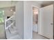 Open foyer with staircase leading to the second floor and adjacent half-bathroom at 2262 Stonehedge Loop, Kissimmee, FL 34743