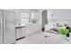 Bright kitchen featuring white cabinets, quartz countertops, and stainless steel appliances at 2262 Stonehedge Loop, Kissimmee, FL 34743