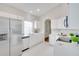 Bright kitchen with white cabinetry, stainless steel refrigerator, and ample counter space at 2262 Stonehedge Loop, Kissimmee, FL 34743