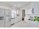 Bright kitchen features stainless steel appliances, white cabinetry, and ample counter space at 2262 Stonehedge Loop, Kissimmee, FL 34743